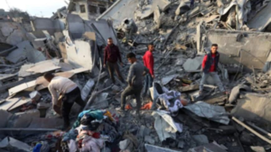 Palestinian Man Searches For Family Beneath Rubble After Israeli Strike Claims Dozens In Gaza